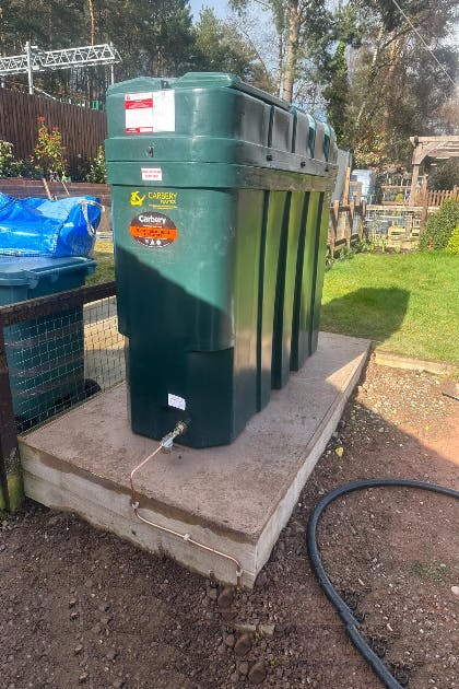 1000 litre bonded oil tank installation with a new concrete pad to meet OFTEC regulations